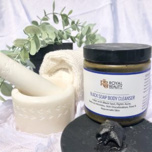 Black soap body cleanser with motar and pestle and white wash cloth