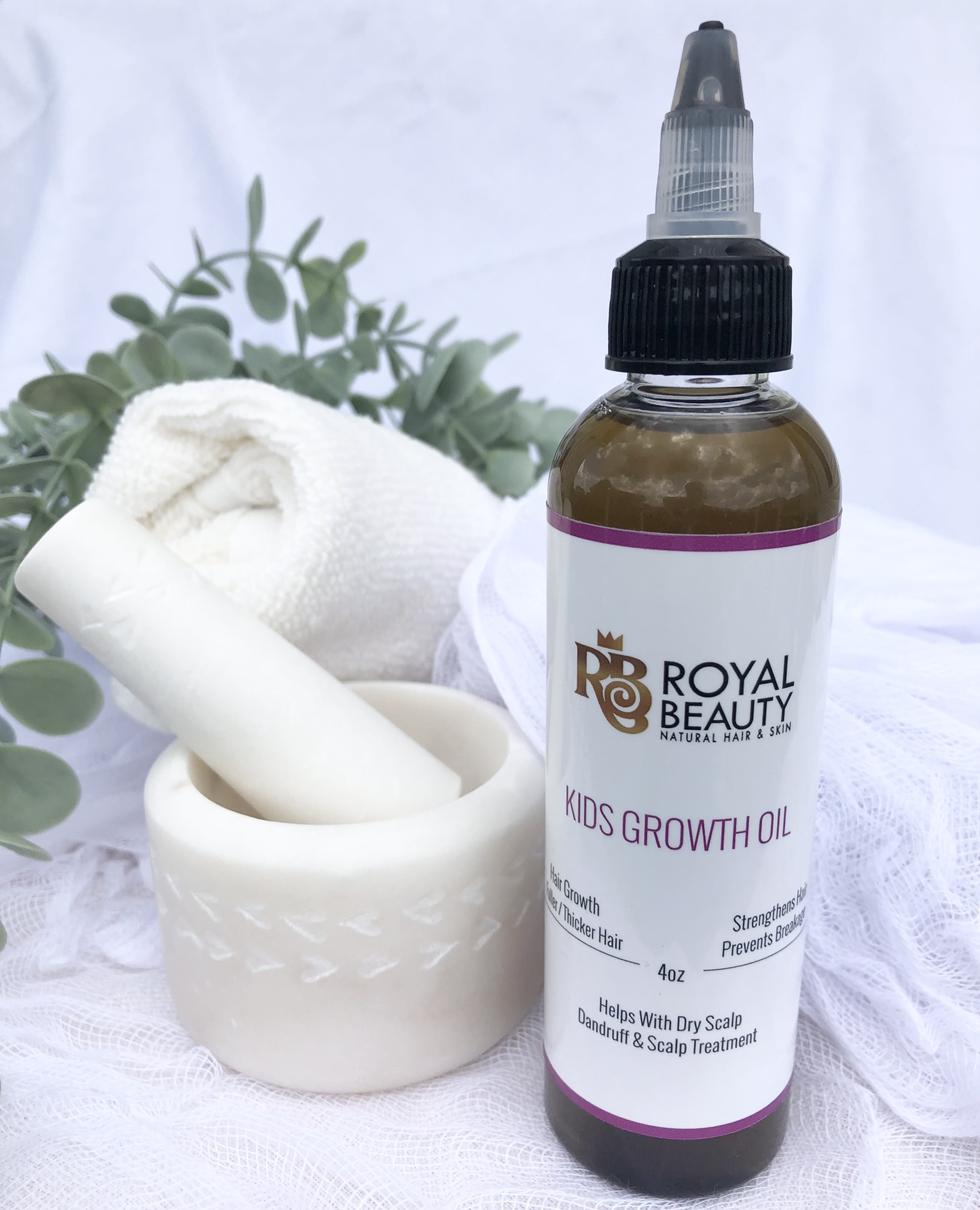 Product Hair Growth Oil with mortar and pestle