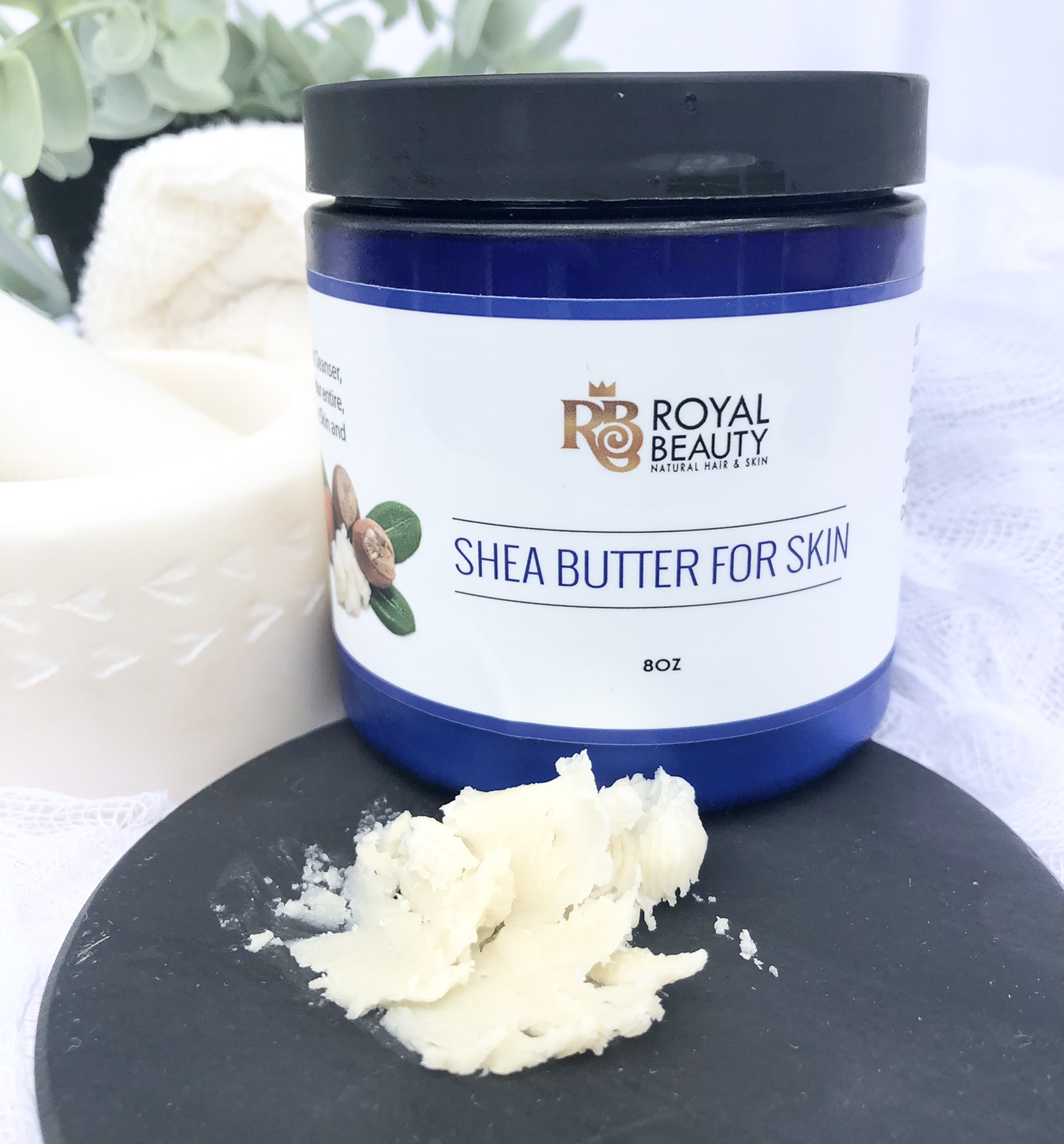 Shea Butter jar with product smear on black disc