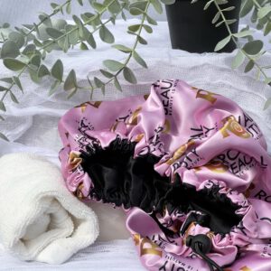 Pink Silk Hair bonnet with plant above it